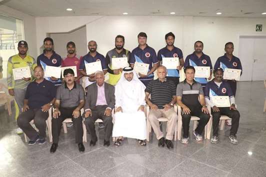 QCA assistant secretary-general Eisa Ali Ghanem and QCA operations manager Manzoor Ahmad with other QCA officials and coaches after the closing ceremony of the coaching camp.