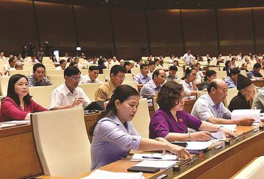 Vietnamu2019s members of parliament attend a session voting to approve a cyber security law in Hanoi yesterday.
