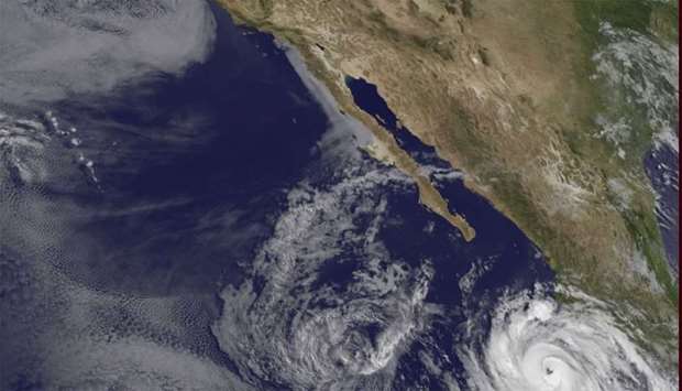 Satellite image  shows hurricane activity in the north Pacific, west of Mexico.
