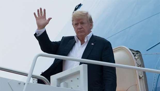 US President Donald Trump disembarks from Air Force One upon arrival at Joint Base Andrews in Maryland on Wednesday, as Trump returns from the summit with North Korean leader Kim Jong-un in Singapore.