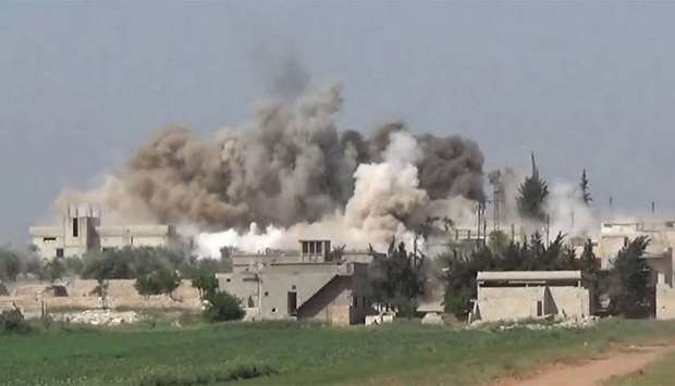Smoke rises after an air strike in Ltamenah. File picture.