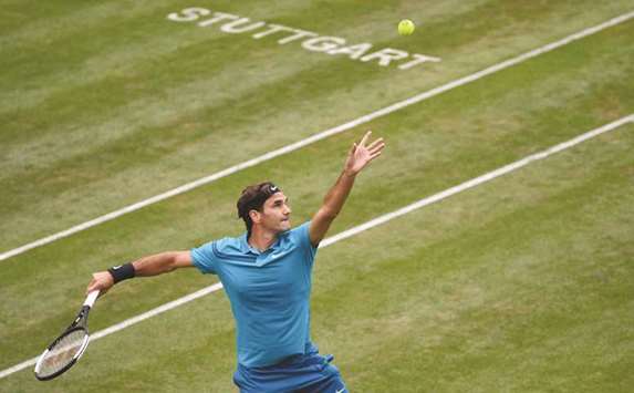 Swiss Roger Federer serves to German Mischa Zverev at the ATP Mercedes Cup in Stuttgart, Germany, yesterday. (AFP)