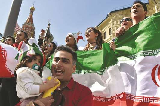 Iranu2019s national football team fans cheer outside the Kremlin in Moscow yesterday.