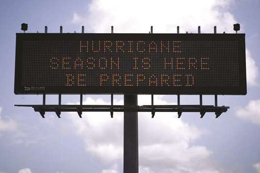 A traffic sign warns of hurricane season in Stowell, Texas.