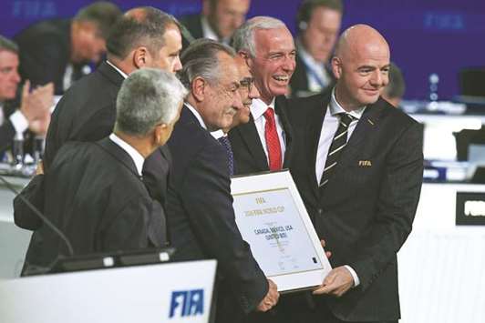 FIFA president Gianni Infantino (right) poses with the United 2026 bid (Canada-Mexico-US) officials, including United States Football Association president Carlos Cordeiro (third from right), Mexican Football Association president Decio de Maria Serrano (third from left) and Canadian Soccer Association president Steve Reed (second from right), following the announcement of the 2026 World Cup host during the 68th FIFA Congress in Moscow yesterday. (AFP)