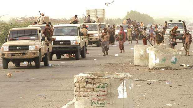 Yemeni pro-government forces arrive in Al-Durayhimi district, about nine kilometres south of Hodeida international airport, yesterday.