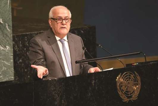Palestinian ambassador to the United Nations Riyad Mansour addresses a United Nations General Assembly meeting ahead of a vote on a draft resolution that would deplore the use of excessive force by Israeli troops against Palestinian civilians at UN headquarters in New York, yesterday.