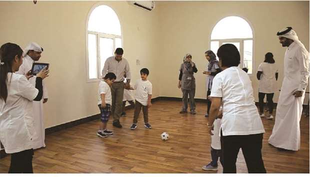 QFC football training for Mind Institute children.