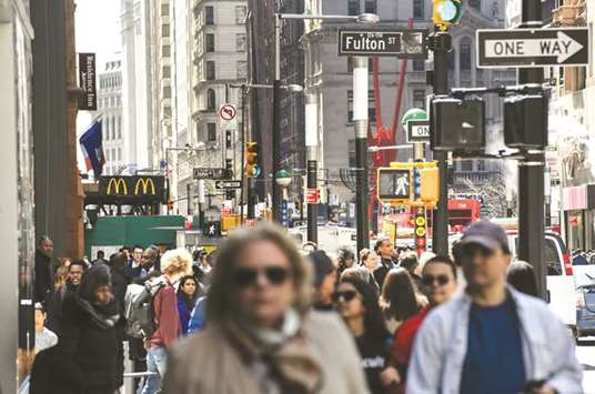 Pedestrians and shoppers walk past Fulton Street in New York. The US Commerce Department said retail sales jumped 0.8% last month, the biggest advance since November 2017.