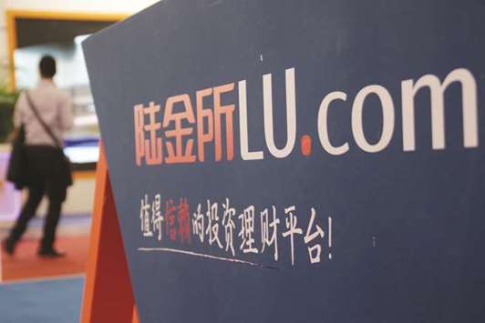 A sign of wealth management platform Lufax is seen during an expo in Beijing. Lufax, set up in 2011 by top insurer Ping An Insurance Group, is working with advisers to raise equity of at least $1bn, sources said yesterday.