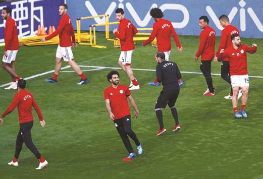 Egyptu2019s Mohamed Salah smiles as he trains  with teammates  in  Yekaterinburg yesterday.