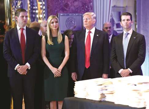 Trump with his children Eric (left), Ivanka, and Donald Jr at the Trump Tower in New York. New York State has announced a lawsuit against the US president and his children over alleged u2018persistent illegal conductu2019 at their family foundation for more than a decade.