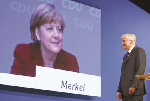 Seehofer with Merkel: allies who have become foes over the chancelloru2019s migrant policy.