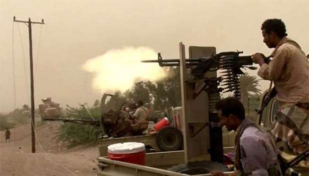 Yemeni pro-government forces firing a heavy machine gun south of Hodeida airport on Friday.