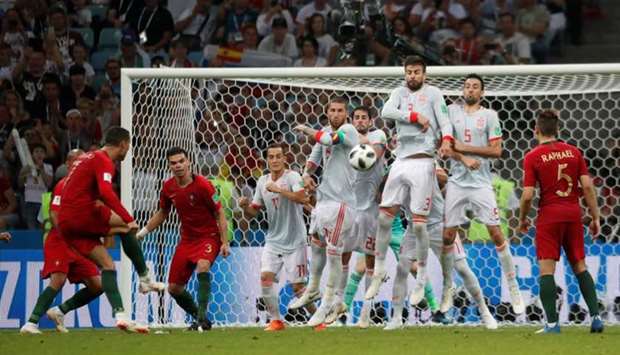 Portugal's Cristiano Ronaldo scores their third goal. Reuters