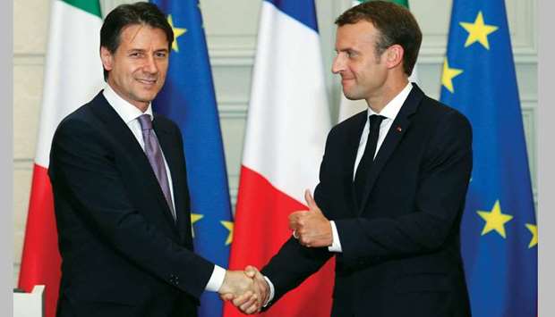 Macron and Conte at the joint press conference following their meeting at the Elysee Presidential Palace in Paris.