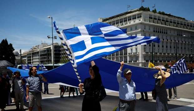 Protesters demonstrate against the agreement reached by Greece and Macedonia to resolve a dispute over the former Yugoslav republic's name, in Athens