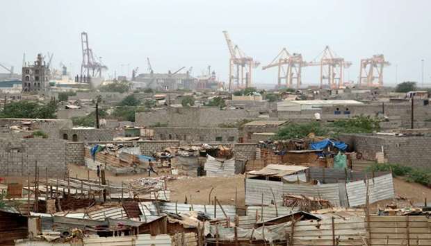 Hodeidah port's cranes are pictured from a nearby shantytown in Hodeidah, Yemen