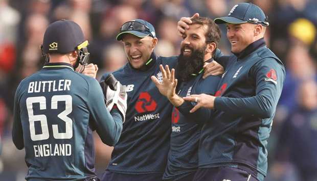 Englandu2019s Moeen Ali (second right) celebrates taking the wicket of Australiau2019s Glenn Maxwell with teammates during the second ODI at Sophia Gardens, Cardiff, yesterday. (Reuters)
