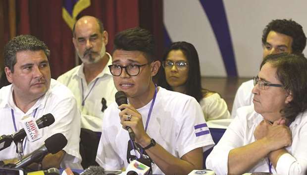 University studentsu2019 leader Lesther Aleman (C) attends a conference at the end of the so-called u201cnational dialogueu201d talks among governmentu2019s representatives, Nicaraguau2019s Roman Catholic bishops in an attempt to stifle anti-government unrest at the National Seminary of Our Lady of Fatima in Managua.