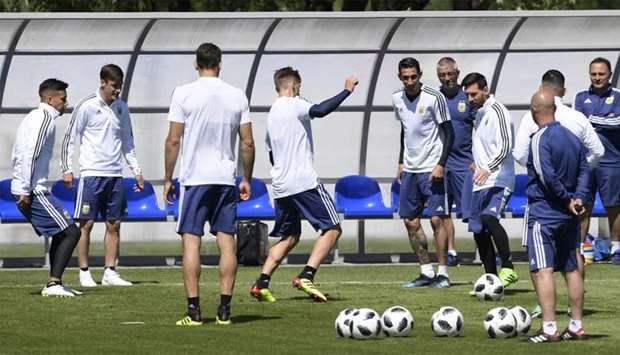 Argentina's forward Lionel Messi (3rd R) passes the ball during a training session at the team's base camp in Bronnitsy