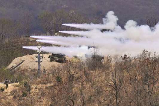 A file picture shows South Koreau2019s K-136 Kooryong 130mm 36-round multiple rocket launch system firing rockets during a media day presentation of a joint live firing drill between South Korea and the US at the Seungjin Fire Training Field in Pocheon, 65km northeast of Seoul.