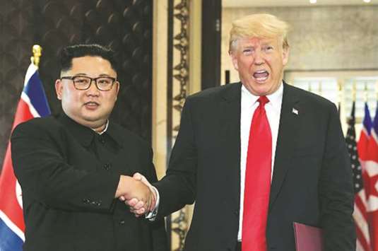 US President Donald Trump greeting North Korean leader Kim Jung-un in Singapore on June 12.