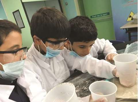 Al-Bairaq students doing research.