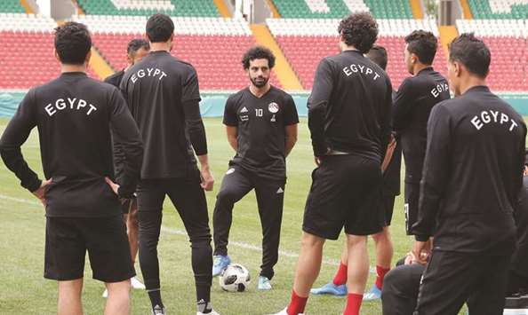 Egyptu2019s Mohamed Salah (centre) speaks to his teammates during a training session in Grozny, Russia, on Sunday. (AFP)
