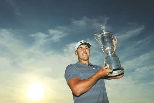 Brooks Koepka of the United States celebrates with the US Open Championship trophy at Shinnecock Hills Golf Club on in Southampton, New York.  (Getty Images)