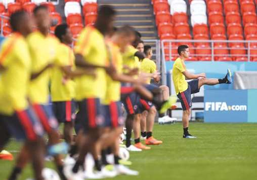 Colombiau2019s James Rodriguez (right) takes part in a training session with teammates on the eve of their Group H match against Japan in Saransk, Russia, yesterday. (Reuters)