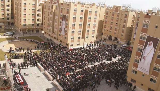 Officials and beneficiaries attend a function during which apartments built as part of the second phase of the residential city of HH Sheikh Hamad bin Khalifa al-Thani in Khan Younis, southern Gaza Strip, were handed over. File picture: February 11, 2017
