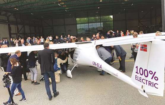 The two-seat electric plane is seen after the test flight at Oslo Airport.
