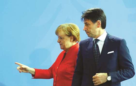 Merkel with Conte leaving the news conference at the chancellery in Berlin yesterday.