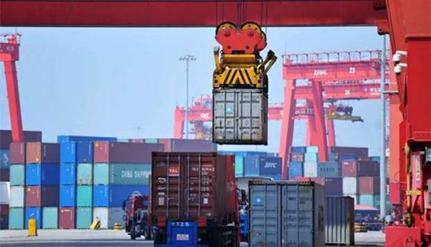 A container is being transferred at a port in Qingdao in China's eastern Shandong province. File picture