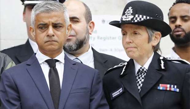 London Mayor Sadiq Khan (left) and Metropolitan Police Commissioner Cressida Dick stand on the steps of Islington Town Hall with community and police leaders on the anniversary of the Finsbury Park attack, in London on Tuesday.