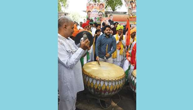 A Youth Congress worker beats a drum while celebrating the 48th birthday of Congress president Rahul Gandhi outside Congress headquarters in New Delhi yesterday.