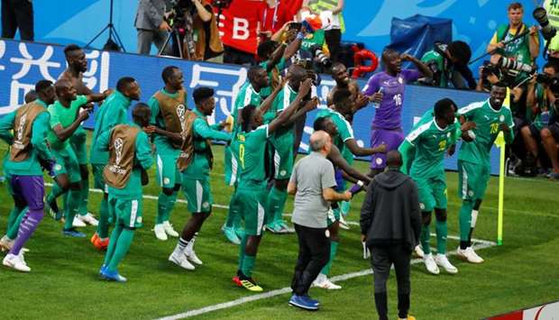 Senegal players celebrate after the match