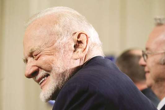 Former astronaut Buzz Aldrin laughs at a joke told by US President Donald Trump at meeting of the National Space Council in the East Room of the White House in Washington on Monday.