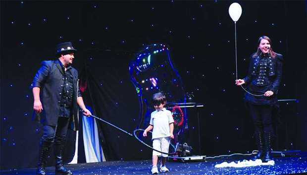 A young boy joins the bubble show. PICTURE: Shemeer Rasheed.rnrn