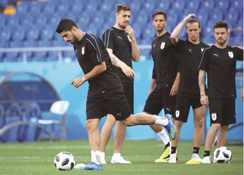 Uruguayu2019s Luis Suarez (left) during a training session with his teammates in Rostov-on-Don, Russia, yesterday. (Reuters)