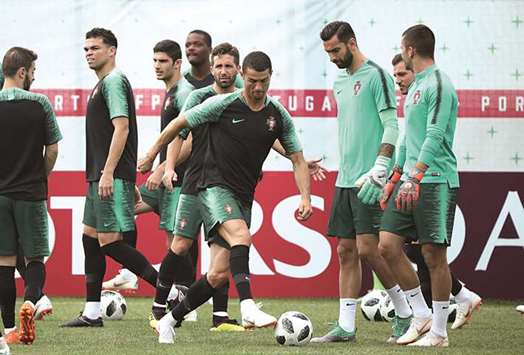 Portugalu2019s Cristiano Ronaldo (centre) takes part in a training session on the eve of their match against Morocco in Moscow, Russia, yesterday. (Reuters)