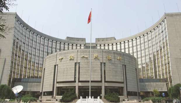 The Peopleu2019s Bank of China building in Beijing. The PBoC will also make sure that structural de-leveraging progresses with the right strength and at the right pace to promote stable and sound economic growth and prevent systemic financial risks, central bank governor Yi Gang said.