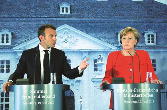 Macron speaks during the press conference with Merkel at the Meseberg Palace, northeastern Germany.