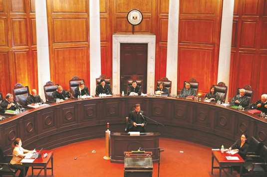 Justices take part in an en-banc session at the Supreme Court in Manila, yesterday.
