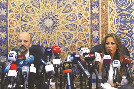 Jordanu2019s Minister of State for Media Affairs Juamana Ghunaimat speaks during a news conference with Prime Minister Omar al-Razzaz in Amman, yesterday.