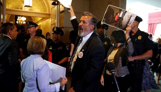 Rep. Juan Vargas (D-CA) and other Democratic members of Congress protest family separations at the US-Mexico border as US President Donald Trump departs after addressing a closed House Republican Conference meeting on Capitol Hill, in Washington, US