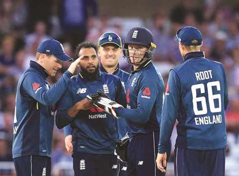 England players celebrate their victory in the third One-Day International over Australia at Trent Bridge cricket ground in Nottingham, England, on Tuesday. (AFP)