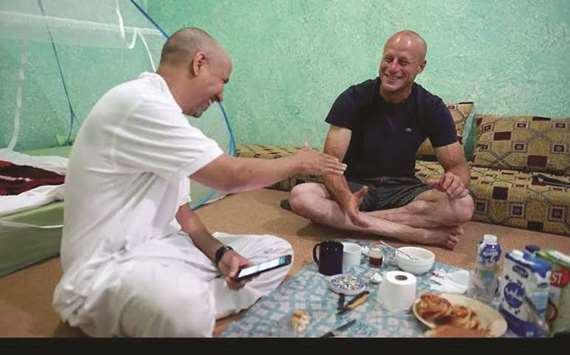 REMARKABLE STORY: Former captive Mohamedou Ould Slahi with his former guard Steve Wood hanging out in Slahiu2019s living room in Mauritania.
