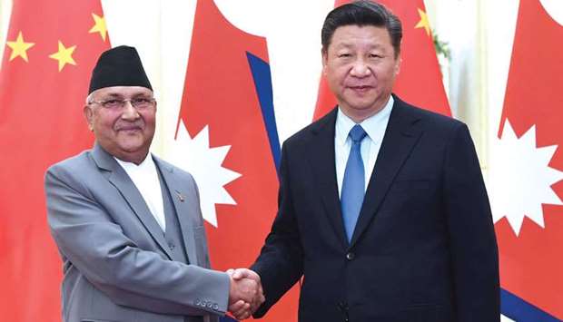 Chinese President Xi Jinping shaking hands with Nepalu2019s PM Oli at the Great Hall of the People in Beijing yesterday.